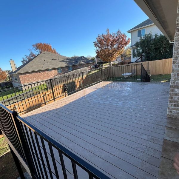 Deck pressure washing during annual maintenance service in Austin