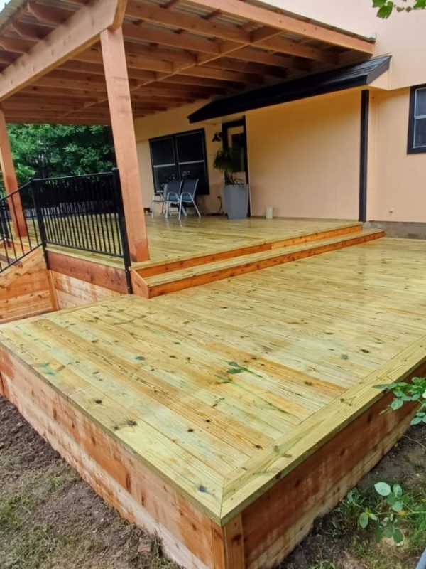 Cedar deck staining and resealing on Central Austin Texas backyard