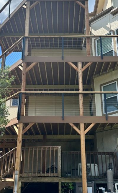 Connecting stairs between deck tiers on multi-level Austin build