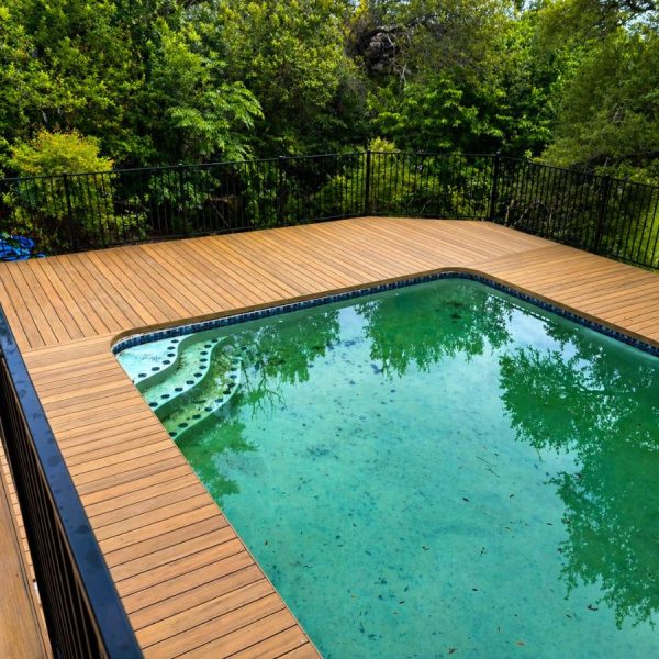 Pool deck surround installation in Round Rock Texas residential backyard