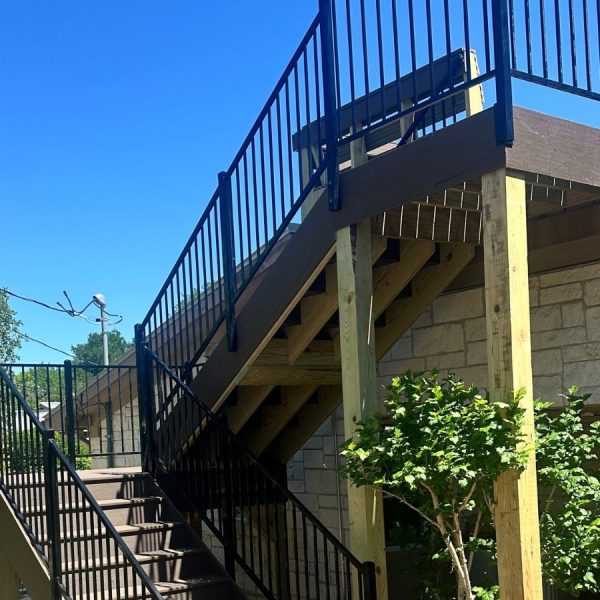 Rooftop deck installation on modern flat-roof East Austin Texas home